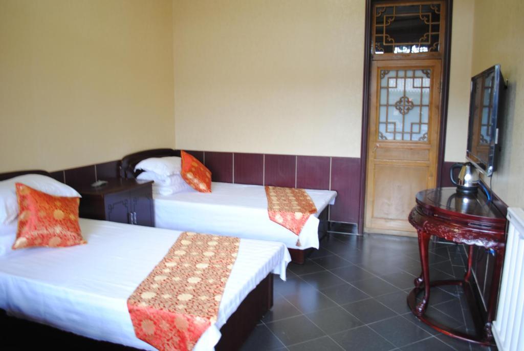 Pingyao Hong Jin Tai Fork Inn Part B Номер фото